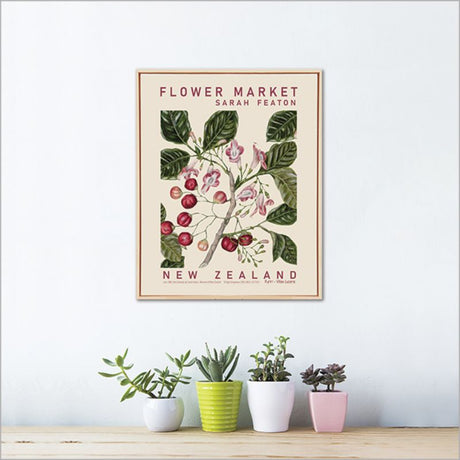 Framed canvas wall art featuring vibrant Puriri flowers and leaves, beautifully printed from Sarah Featon's watercolor illustrations.