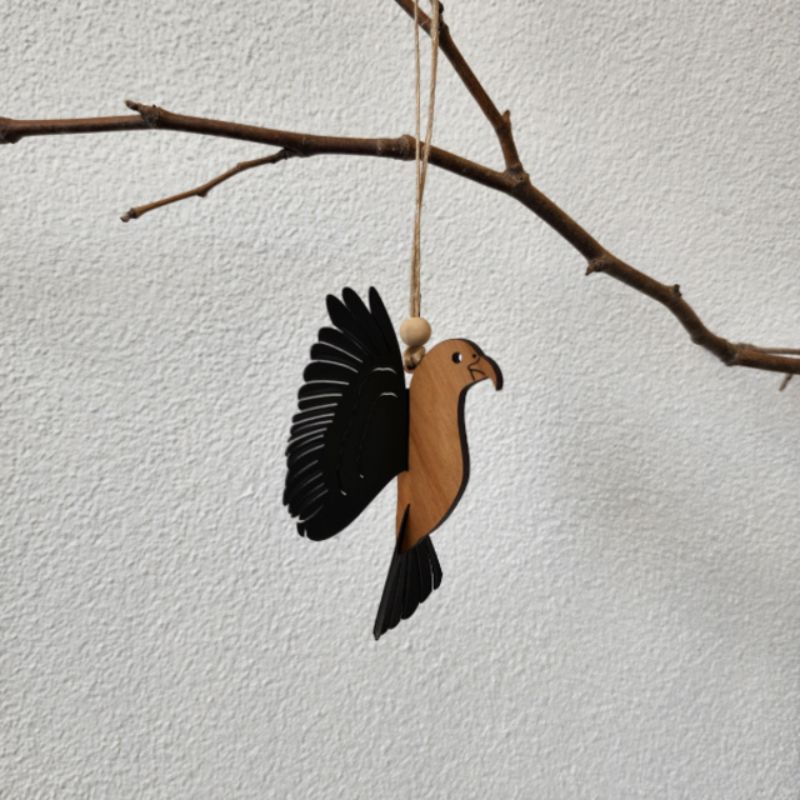 Intricate Rimu Kea hanging ornament with 3D wings, showcasing New Zealand culture, perfect for home decor or gifts.