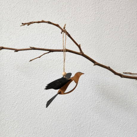 Hanging ornament of a Rimu Kereru, featuring 3D polypropylene wings and intricate laser-cut Rimu Veneer, 11.2cm size.