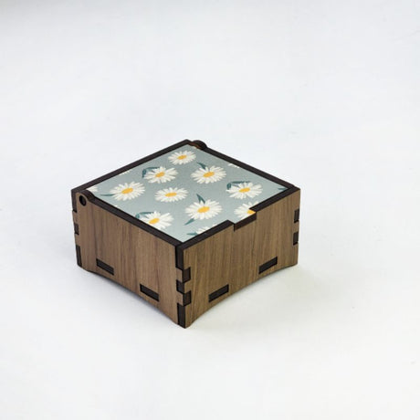 Square wooden trinket box made from reclaimed River Rimu, featuring a Mountain Daisy design, measuring 8cm.