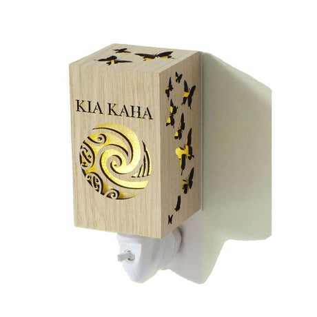 Kia Kaha Wood Grain Plug In Night Light with warm glow, perfect for children's rooms and hallways, enhances home ambiance.