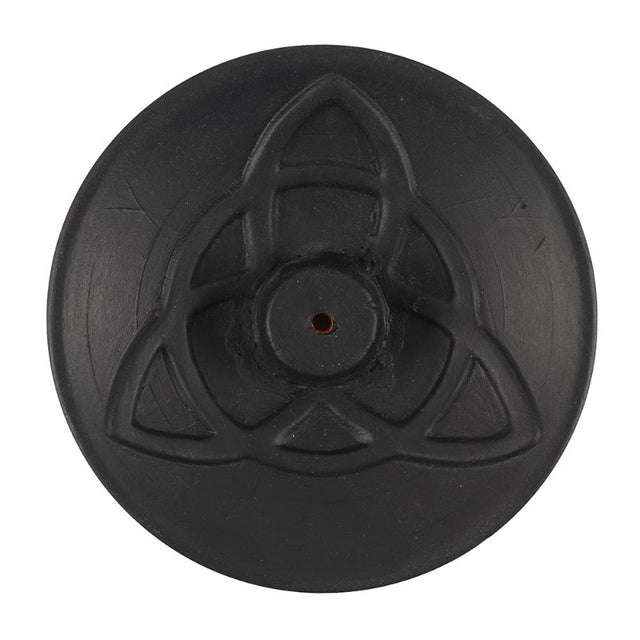 Black terracotta incense plate with triquetra design, ideal for meditation and enhancing home ambiance.