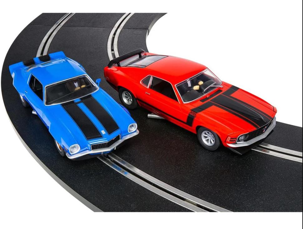 Scalextric American Street Race Duel Slot Car Set featuring Camaro and Mustang on a 532 cm track with stunt ramp and barriers.