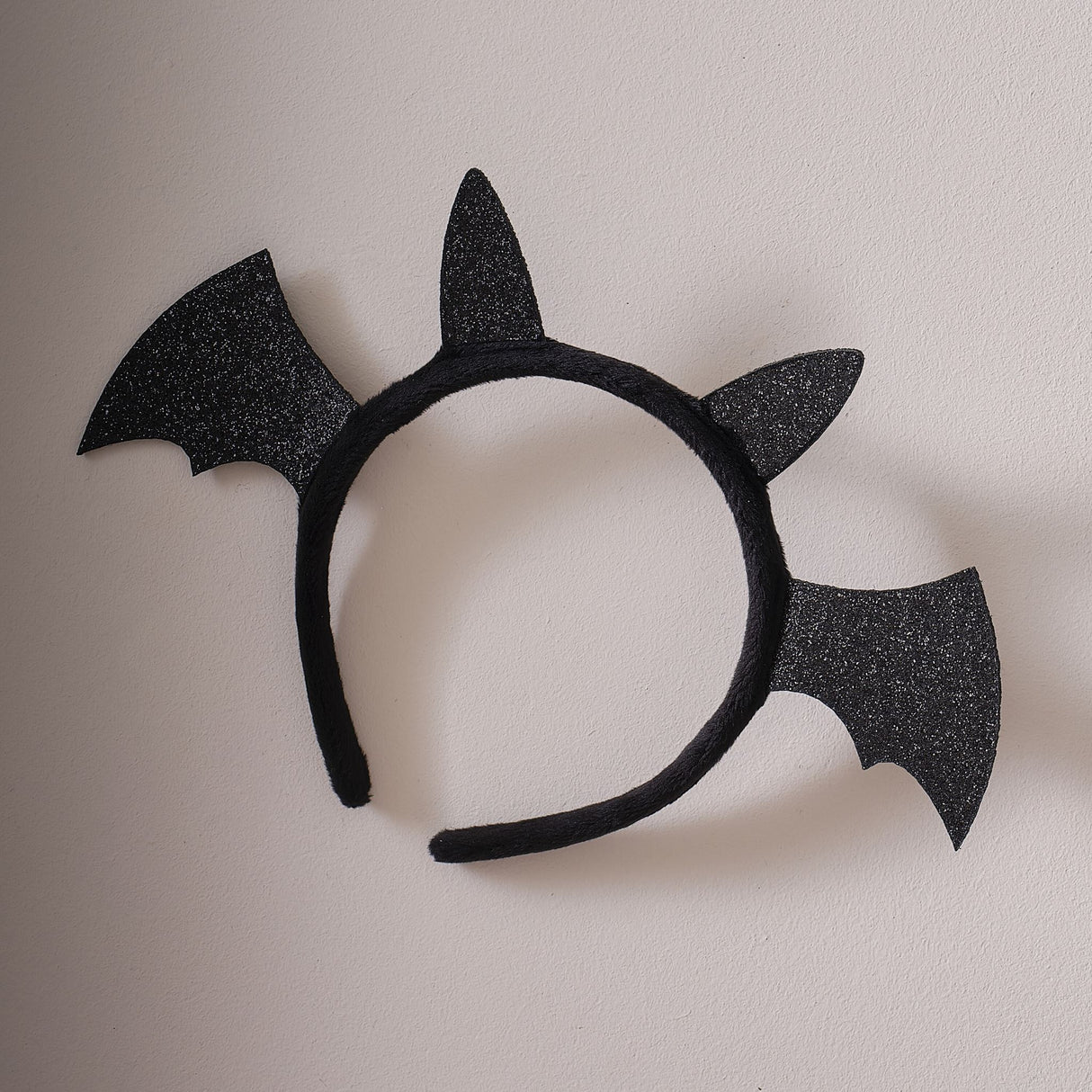 Black Sparkle Bat Headband with glitter wings, perfect for Halloween costumes and imaginative play, eco-friendly packaging.