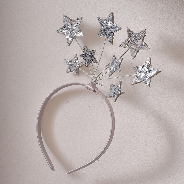 Pink satin headband with eight shimmering silver sequin stars, perfect for fairy costumes and dress-up play.