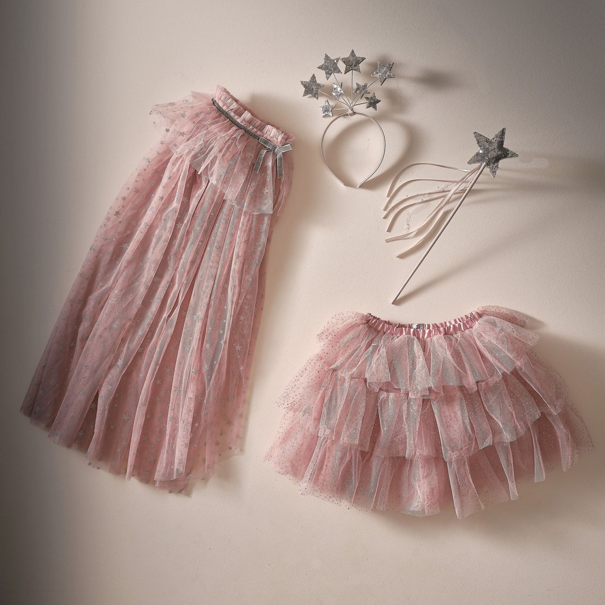 Fairy wand with pink satin, sparkling silver sequin star, and satin ribbons, perfect for magical dress-up fun.