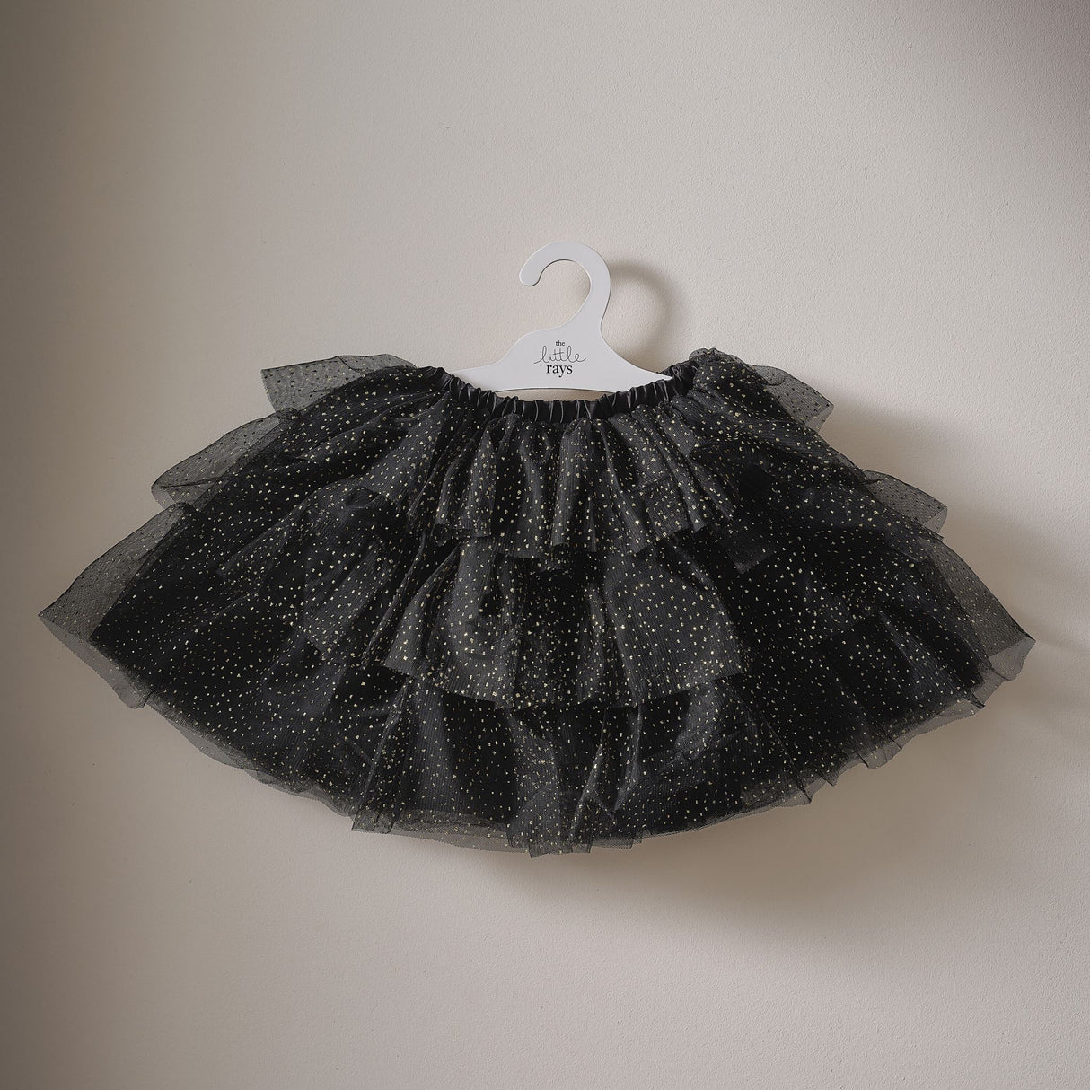 Black and gold sparkle tutu for ages 3-5, perfect for Halloween dress-up or imaginative play, featuring an elastic waistband.