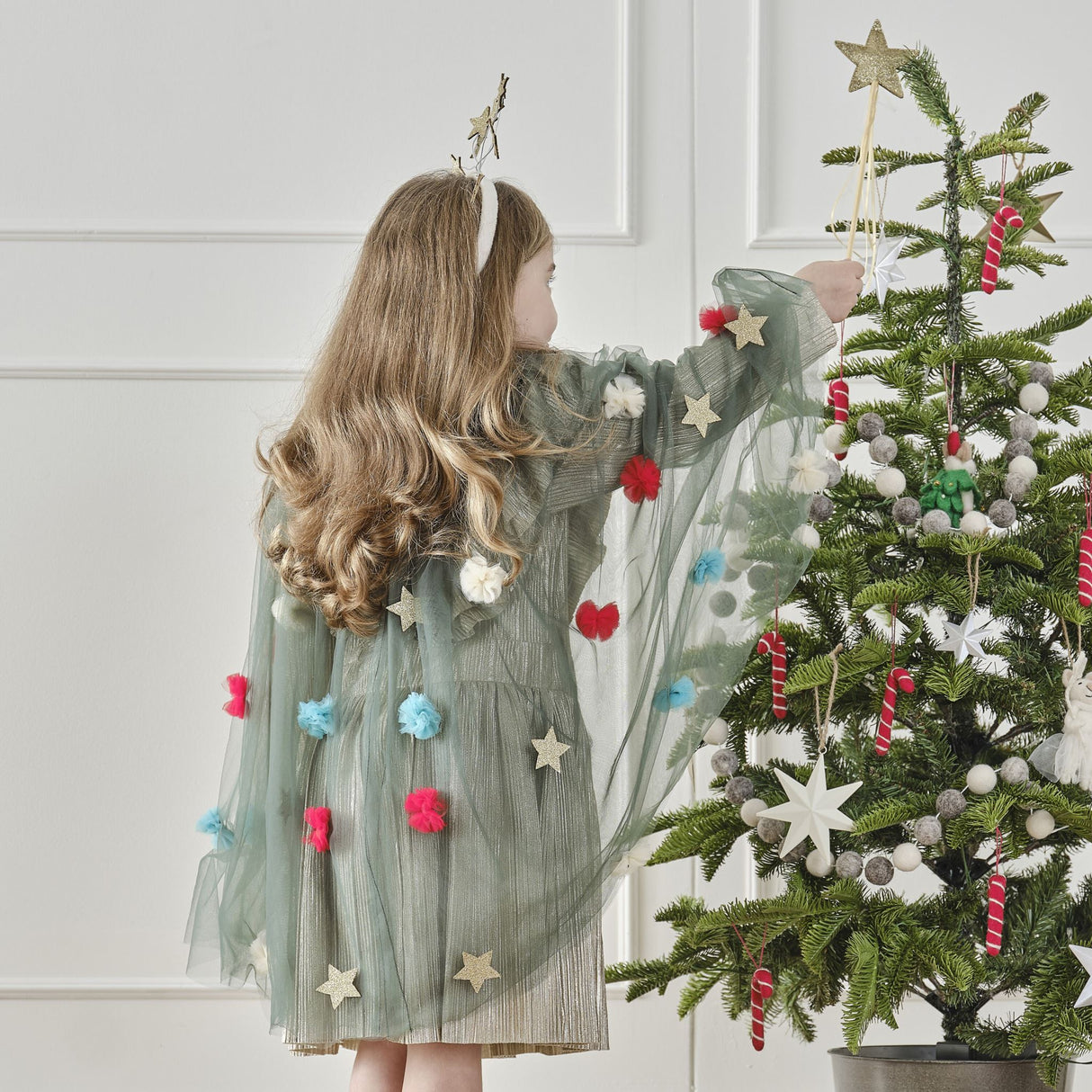 Gold satin fairy wand topped with a glittering gold star, perfect for imaginative play and eco-friendly celebrations.