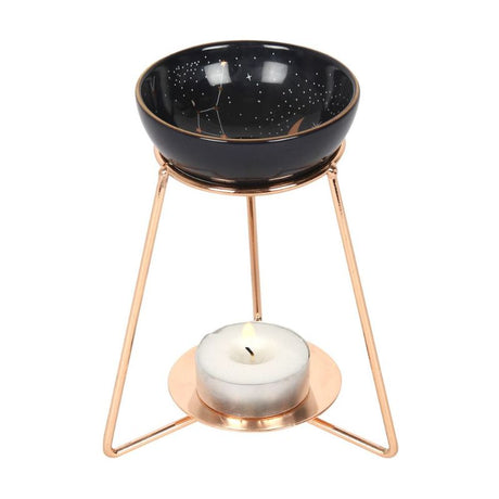 Purple star sign oil burner on elegant gold metal base, featuring a celestial dish for creating enchanting aromas.