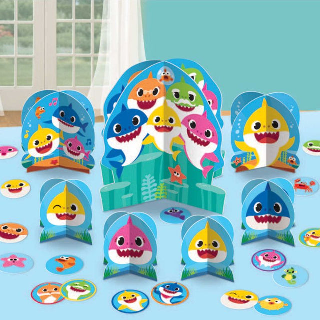 Colorful Baby Shark table decorating kit with centerpieces and confetti, perfect for parties and baby showers.