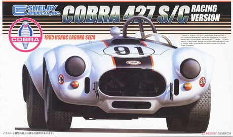 Unassembled Fujimi 1/24 scale Shelby Cobra 427 S/C model kit, showcasing classic American muscle car design for hobbyists.