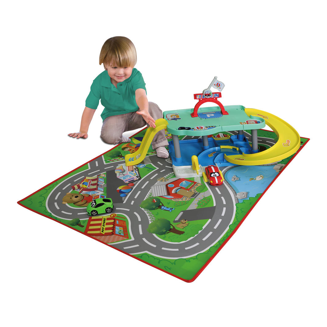 BB Junior garage playset with wipeable city mat, two licensed cars, and a two-level garage featuring slides and podium.