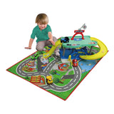 Colorful garage play set with wipeable city mat and two cars, featuring slides, ramps, and a podium for imaginative play.