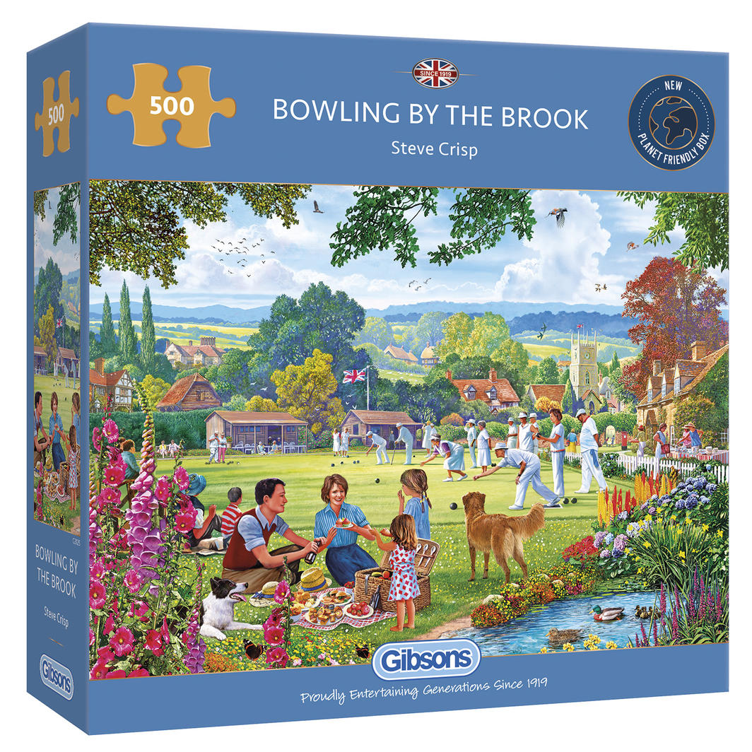 A vibrant 500-piece puzzle depicting a charming English village cricket scene with picnicking families and playful dogs.