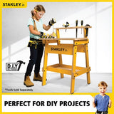 Wooden Stanley Jr. Work Bench for kids, featuring a ruler, tool storage, and ideal for imaginative play and fine motor skill development.