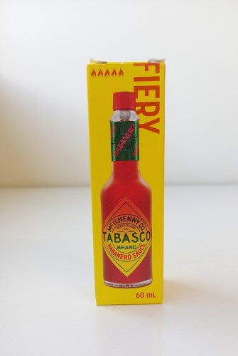 Bottle of Tabasco Habanero sauce, 60ml, featuring fiery habanero flavor for adding heat to dishes and dips.