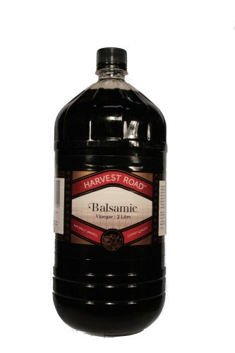 2-liter bottle of Harvest Road balsamic vinegar, perfect for enhancing salads and marinades with sweet-tangy flavor.