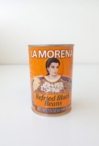 Convenient 440g tin of USDA-certified organic black refried beans, pre-cooked and seasoned for easy meal prep.