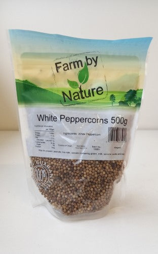 Whole white peppercorns in a 500gm packet, ideal for enhancing flavors in meats, soups, and sauces.