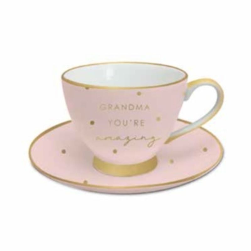 Elegant pink and gold teacup and saucer set with "You're Amazing" inscription, perfect for tea lovers and gifts.