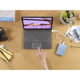 Light blue 1 TB Seagate One Touch Portable Hard Drive, USB 3.0, compact design, perfect for backups on-the-go.