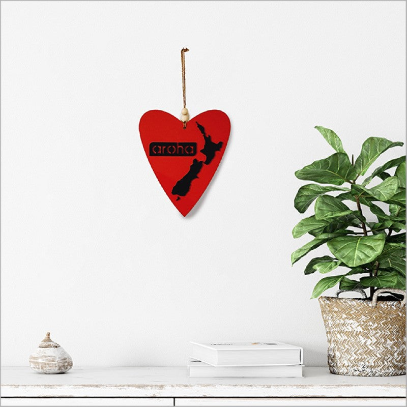 Black ACM heart-shaped wall art featuring 'Aroha', symbolizing love, measuring 230mm x 270mm, ready to hang.