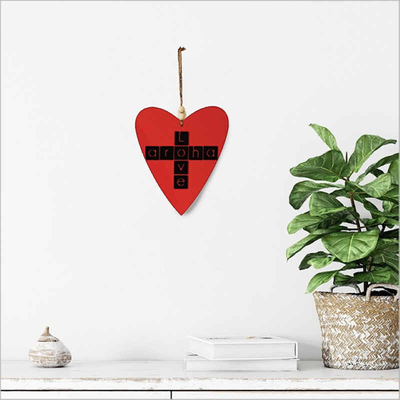 Heart-shaped black acrylic Kiwiana wall art featuring "Aroha + Love," symbolizing New Zealand's warmth and elegance.