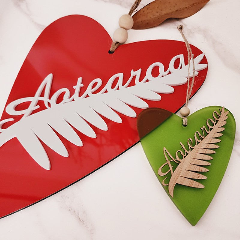 Kiwiana wall art featuring a heart-shaped New Zealand fern in white, crafted from durable ACM, perfect for home decor.