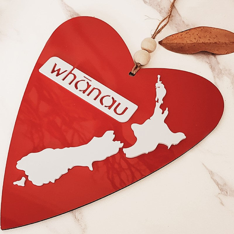 Heart-shaped Kiwiana wall art featuring Whanau design in white, perfect for modern home decor, ready to hang.