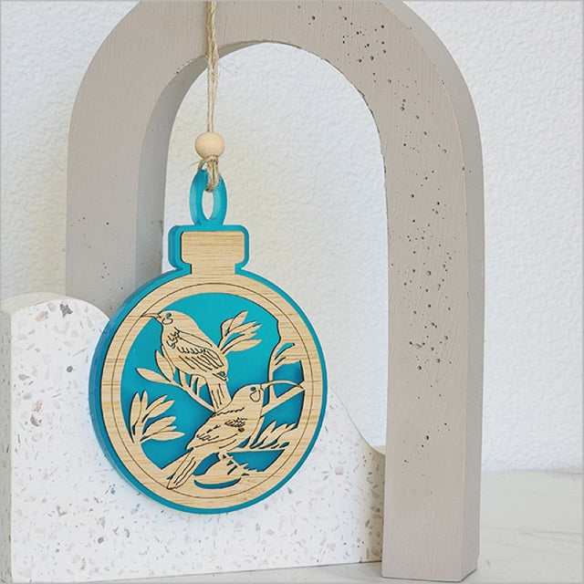 Teal satin acrylic bauble ornament featuring laser-cut bamboo, perfect for festive decorations and gifts.