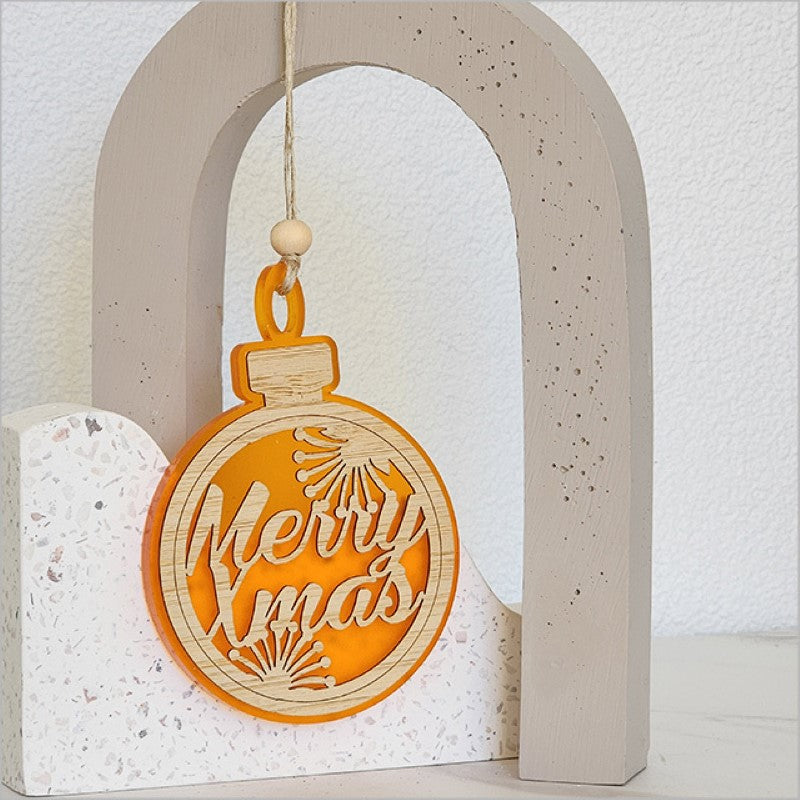 Vibrant orange acrylic bauble ornament with "Merry Xmas" design, ideal for festive holiday decor or gifting.