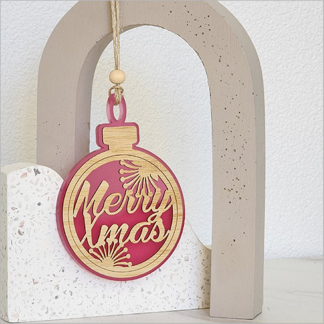 Pink satin acrylic hanging ornament with laser-cut bamboo base, perfect for Christmas tree decor or gifting.