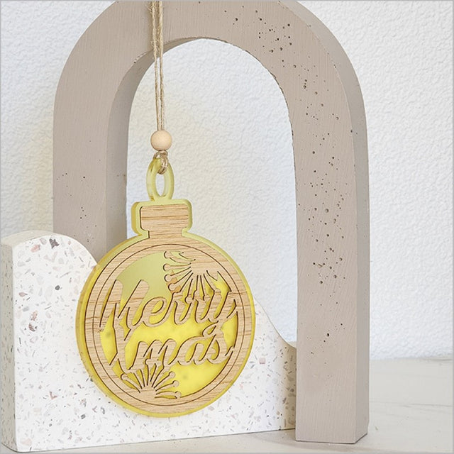 Bright yellow acrylic bauble ornament saying "Merry Xmas", perfect for modern holiday decor, 80mm x 110mm, ready to hang.