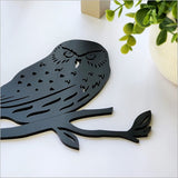 Black acrylic Morepork wall art, minimalist design, 107mm x 92mm, ideal for modern home decor and easy to mount.