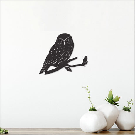 Black Acrylic Morepork wall art, measuring 107mm x 92mm, perfect for modern decor and easy wall mounting.