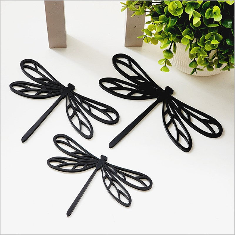 Acrylic wall art set featuring three sleek black dragonflies, perfect for modern home or office decor.