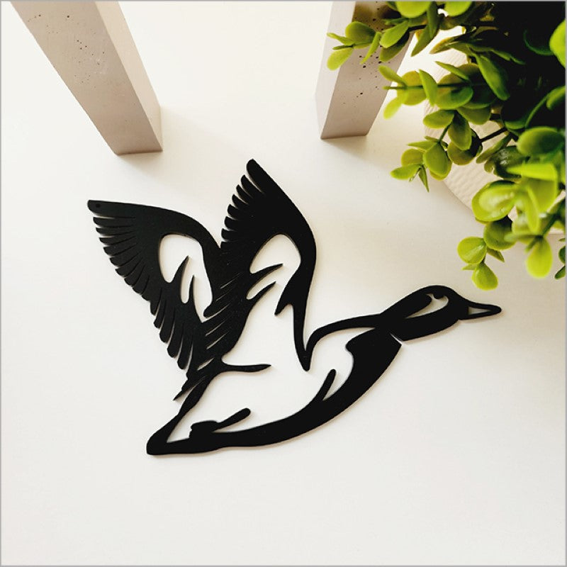 Stylish black acrylic wall art featuring a minimalist flying duck design, perfect for modern home decor at 22cm size.