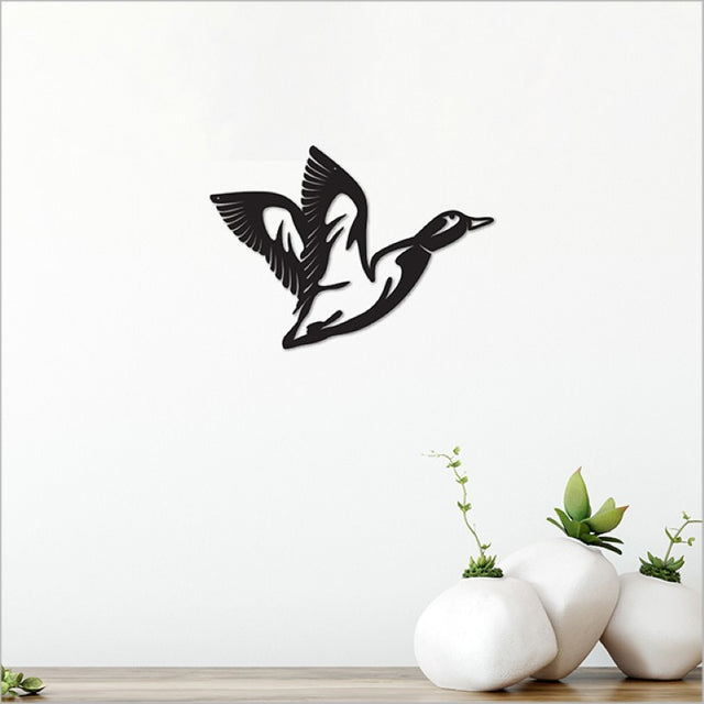 Acrylic wall art of a minimalist black flying duck, perfect for modern home decor and easy to mount.