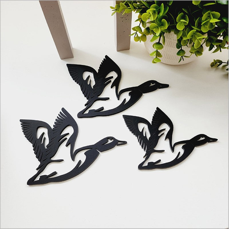 Elegant black acrylic wall art featuring three flying ducks, perfect for modern home decor and easy to mount.