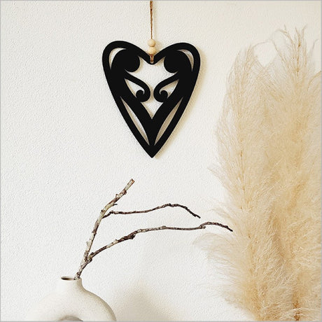 Black acrylic wall art featuring a unique 6 Koru Heart design, symbolizing love and connection, ready to hang.