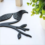 Black acrylic wall art featuring a stylish Kereru, ideal for modern decor in any living space.