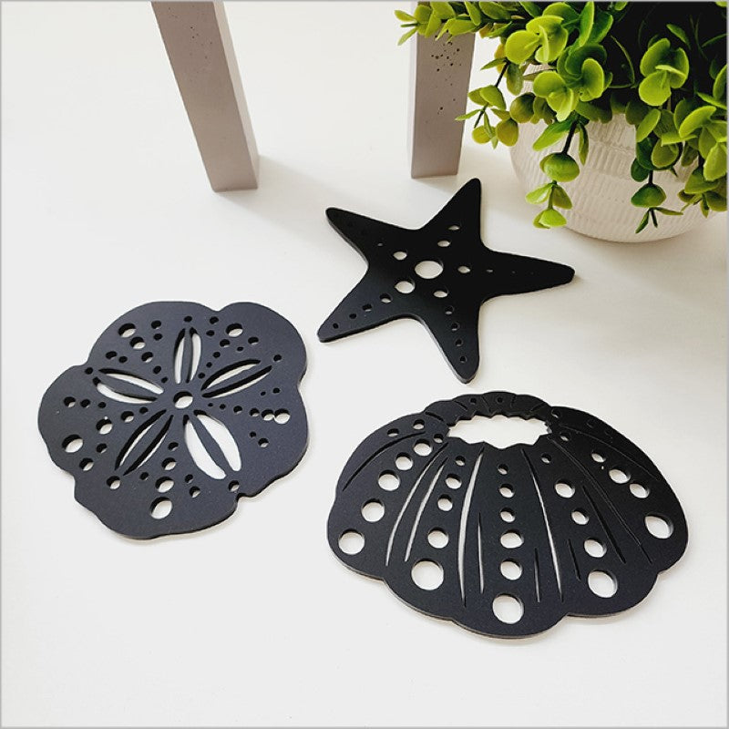 Acrylic wall art set featuring black kina and starfish, perfect for marine decor and easy to mount on any wall.