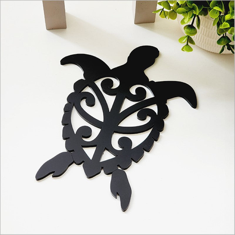 Acrylic wall art depicting a black honu turtle, perfect for coastal-themed home decor, easy to mount and ideal for gifting.