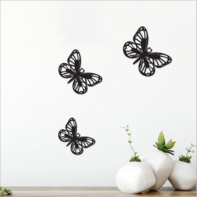 Acrylic wall art set featuring three matt black pieces in various sizes, perfect for modern home decor.