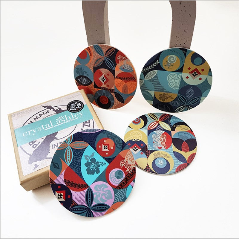 Set of coastal-inspired coasters with vibrant Pacific prints, acrylic top, and cork base for stylish drink protection.