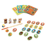 Wooden educative game set by Djeco with four classic games for toddlers, featuring a woodland animal theme and decorative storage box.