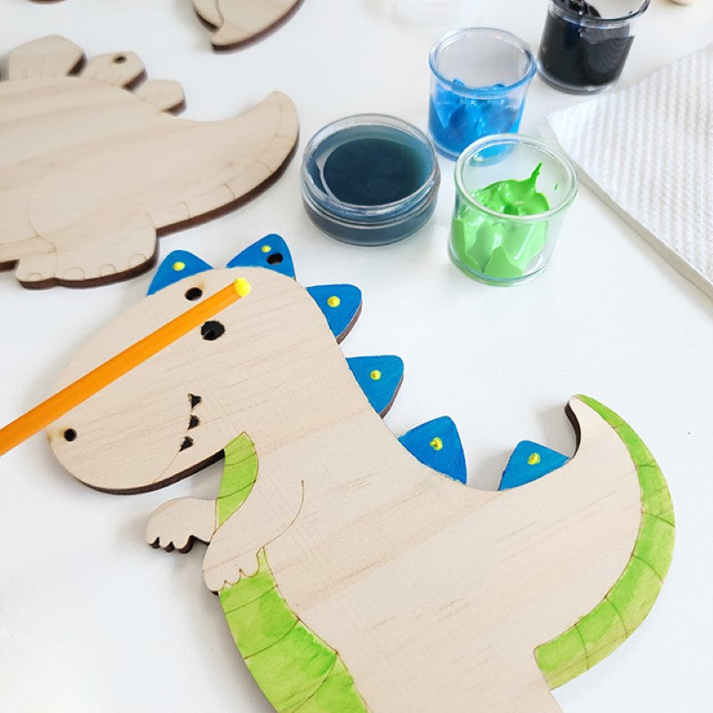 Colorful DIY dinosaur garland kit for kids, featuring wooden pieces, non-toxic paints, and easy instructions for creative fun.