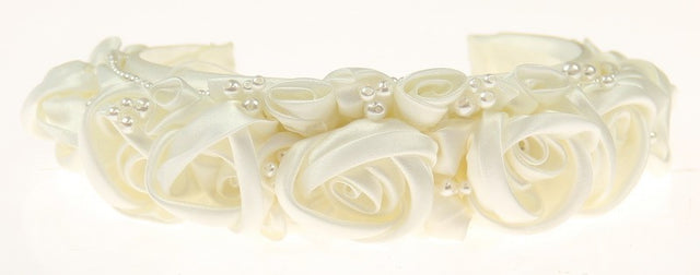 Ivory roseette band bridal headpiece with delicate embellishments for an elegant, romantic wedding look.