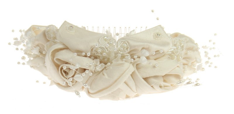 Elegant ivory comb headpiece with intricate detailing, perfect for modern brides' timeless wedding looks.