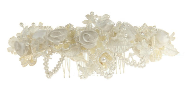 Elegant white pearl bridal comb with silver accents, perfect for enhancing wedding hairstyles and adding sophistication.